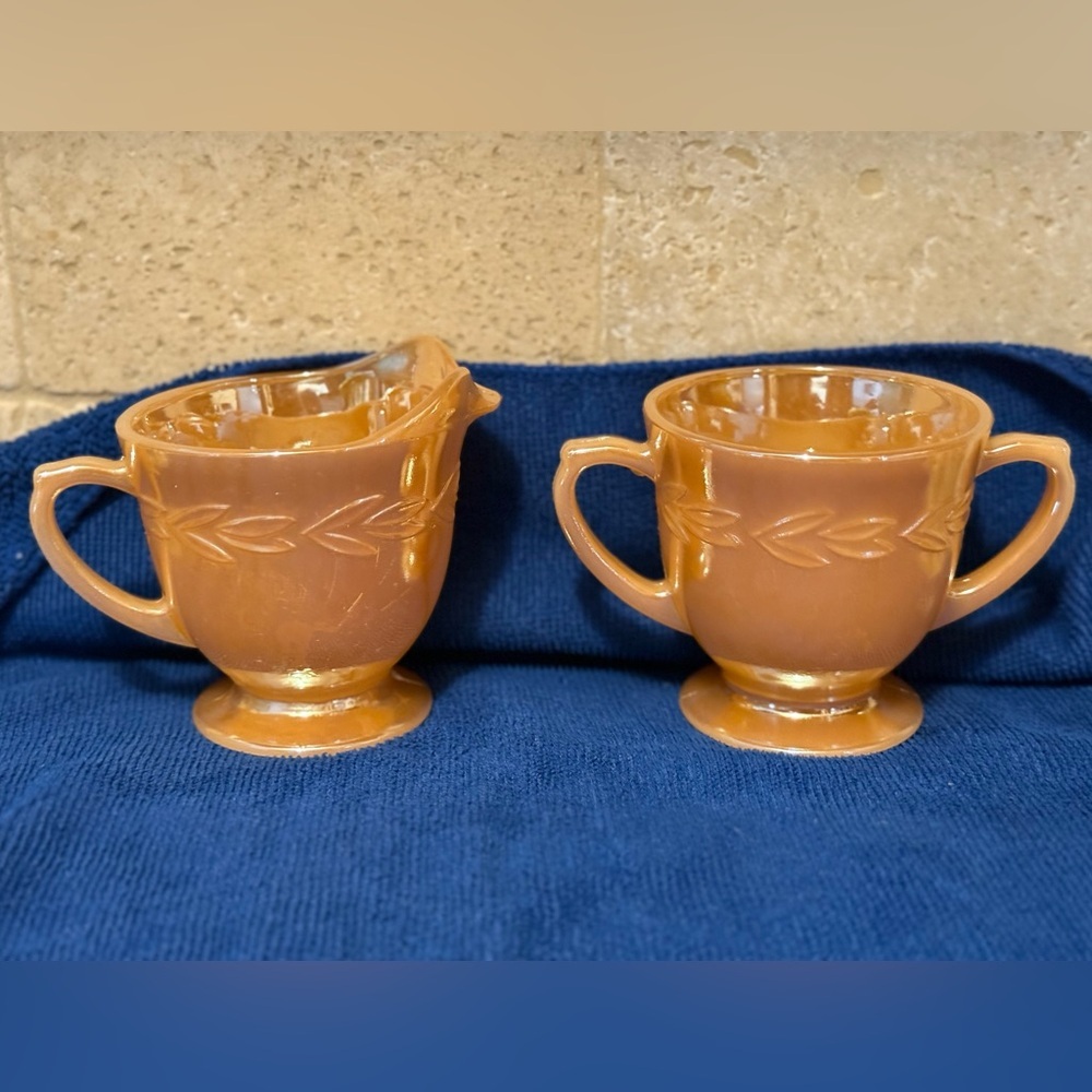 Fire King Peach Lustre Creamer & Sugar Bowl set, featuring the "Laurel" pattern